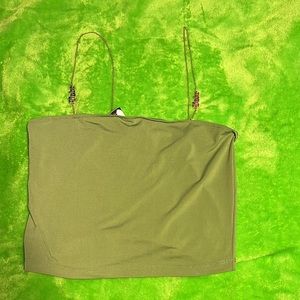 Cute olive green crop top. Has gold straps with the word ‘Babe’. Stretchy.